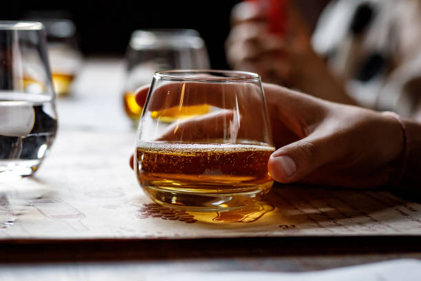 istock Glass with alcohol in hand. 1282845213