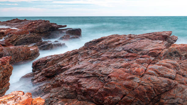 istock Long Exposure Of Sea With Smooth Wave And Rock 1282845579