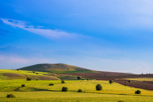 istock Agricultural fields and hills at sunset 1282845656