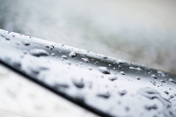 istock Drops of water on a blue glass texture background 1282845702