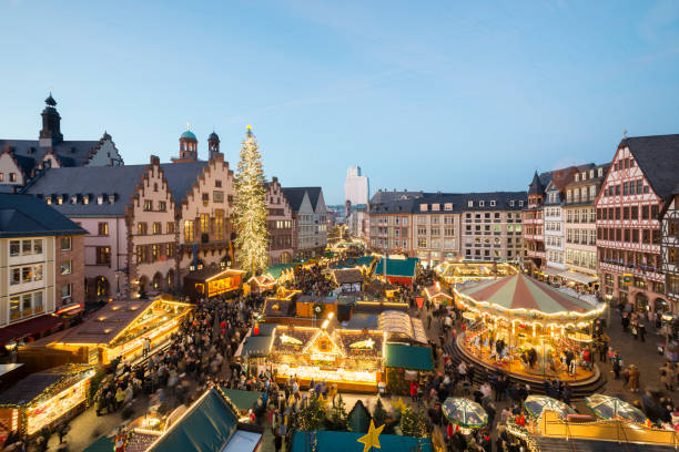 Night Christmas market with illuminade facade  at Roemerberg , a public space in Frankfurt.