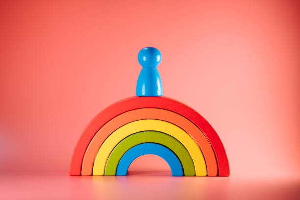 istock The single wooden people on rainbow bloc 1282847427