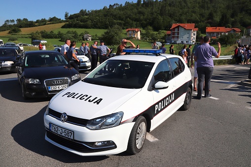 Bosnian police car (VW Golf) securing Ajvatovica procession in Bosnia. Ajvatovica is the biggest Islamic traditional event in Europe.
