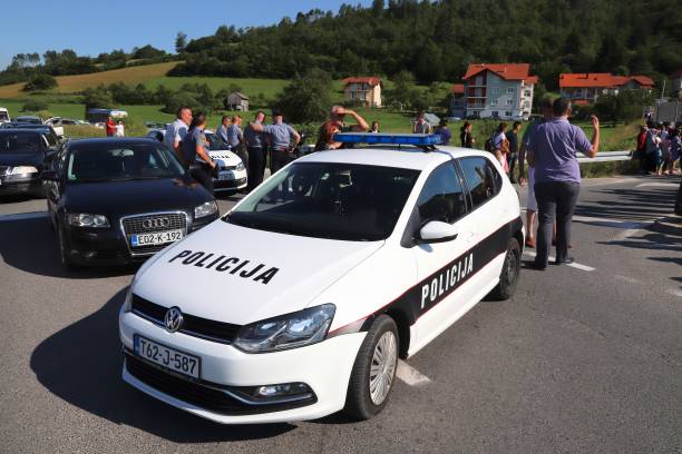 Bosnia Police car Bosnian police car (VW Golf) securing Ajvatovica procession in Bosnia. Ajvatovica is the biggest Islamic traditional event in Europe. bosnia and hercegovina stock pictures, royalty-free photos & images