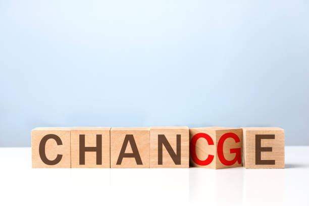 istock Wooden letters on a blue background with change concept. 1282851288