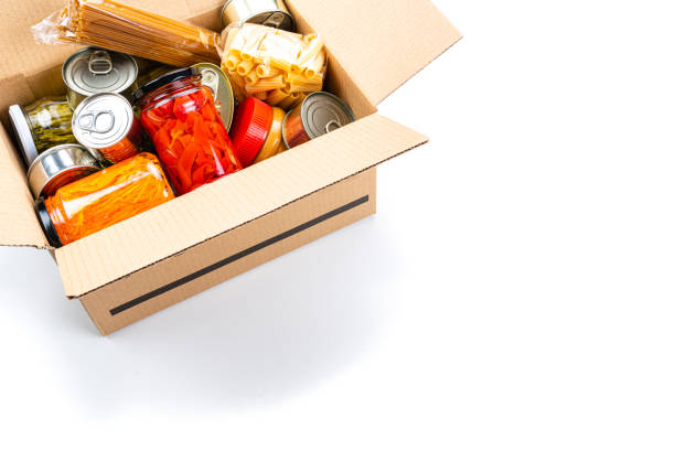 istock Cardboard box filled with non-perishable foods. High angle view with copy space. 1282852378