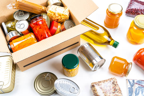 istock Cardboard box filled with non-perishable foods. High angle view. 1282852386