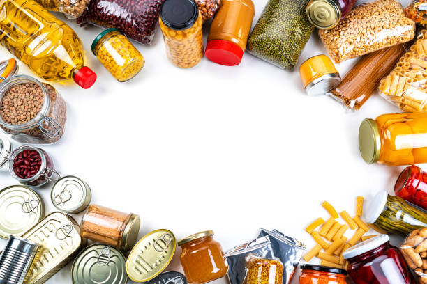 istock Non-perishable food background: canned goods, conserves, sauces and oils. Overhead view. 1282852419