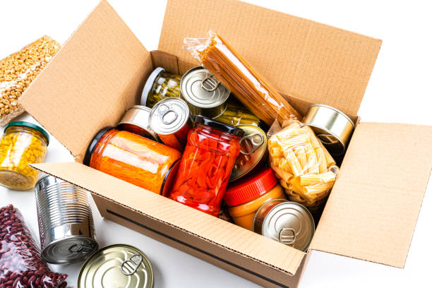 istock Cardboard box filled with non-perishable foods. High angle view. 1282852440