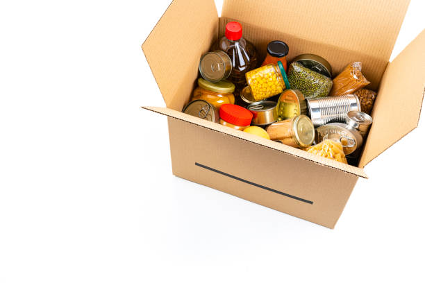 istock Cardboard box filled with non-perishable foods. High angle view with copy space. 1282852443