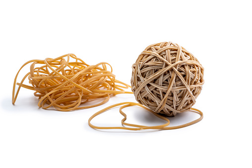 boredom at the office, Rubber band ball, more loose rubber bands, isolated on a white background