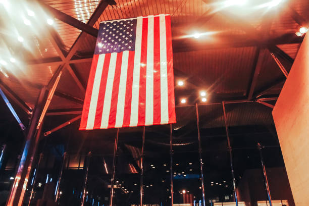 istock American flag hanging from the ceiling in a glass room 1282856683