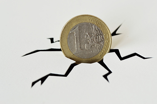 Euro coin in cracked ground - Crash of euro concept
