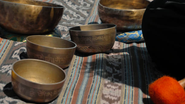 istock Asian guy playing Tibetan singing copper cups on a viewing mountain 1282859813