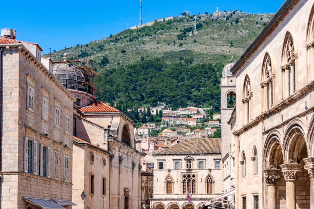 istock Maintenance is always needed for Dubrovnik's historic architectural features and variety within the city.  The landscape beyond its Walls is more modern. 1282859833