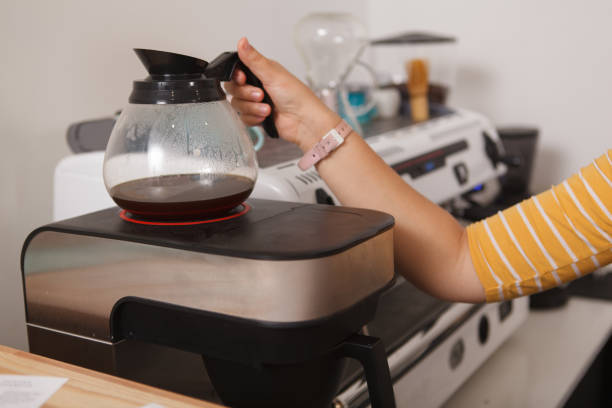 istock Female barista working at coffee shop 1282863870
