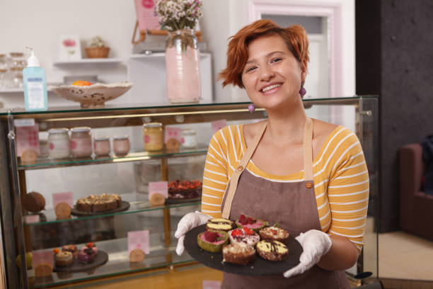 istock Female confectioner working at her cafe 1282863952