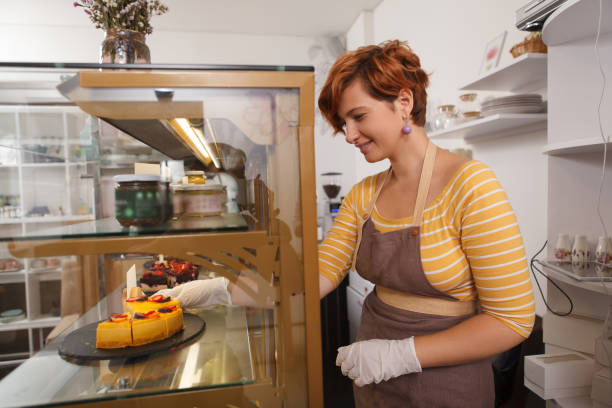 istock Female confectioner working at her cafe 1282864009
