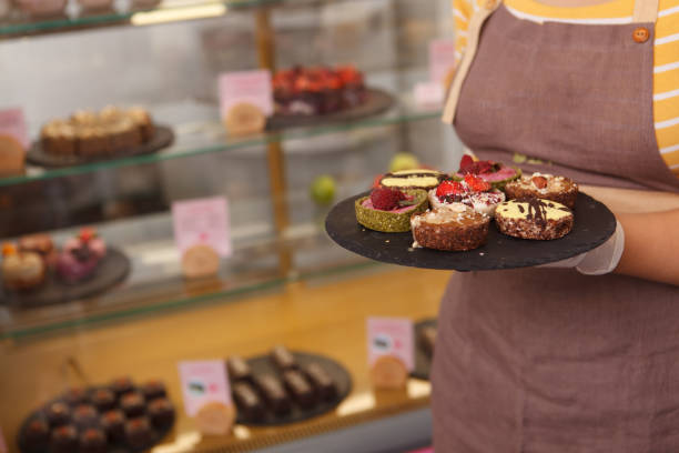istock Female confectioner working at her cafe 1282864060