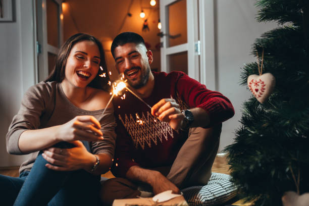 istock Happy caucasian couple holding sprinklers 1282864300