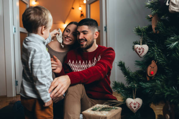 istock family decorating christmas tree 1282864396