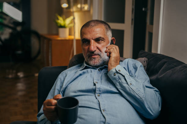 istock middle aged man relaxing at home 1282864434