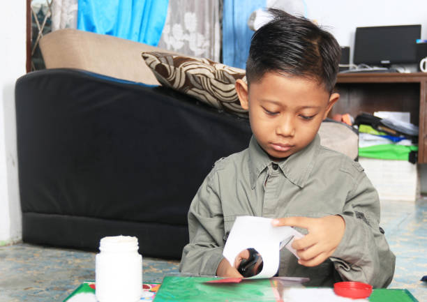 istock An elementary student showing the results of a craft, an assignment from school. 1282866466