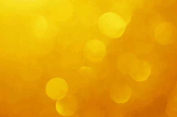 istock glitter light sparkle yellow golden gorgeous bokeh defocused abstract background shiny. 1282866690