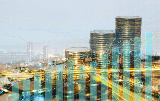 istock double exposure of city with row of coin stack with growth chart and graph progress report for business investment finance banking and money saving concept. 1282866772