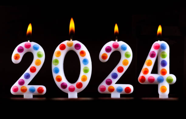 istock Colored candles write numbers flame Happy new year 2024 1282869396