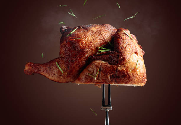 istock Smoked chicken on a fork sprinkled with rosemary. 1282870674