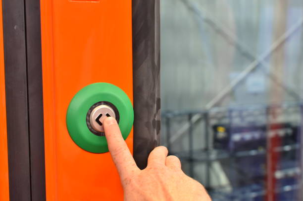 istock The hand presses the button for stop in the train 1282870872