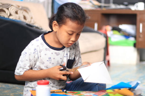 istock An elementary student working on crafts at home during the COVID-19 pandemic. 1282871066