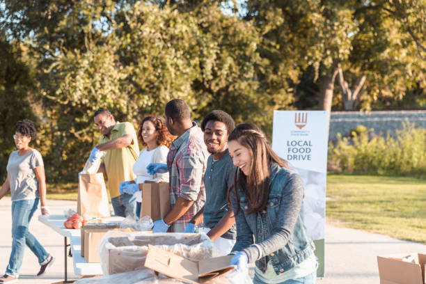 istock Diverse volunteers enjoy working together for food drive 1282871110
