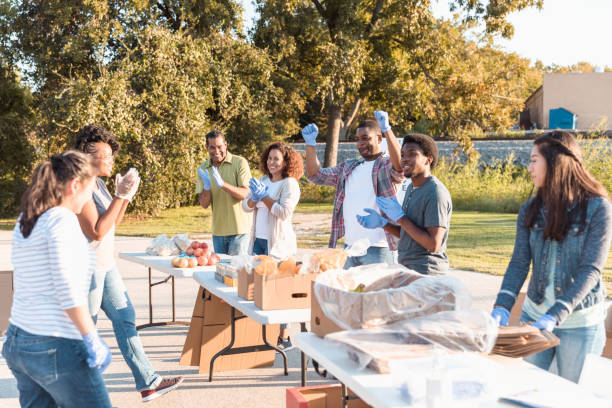 istock Diverse group cheers as they meet their goal 1282871113