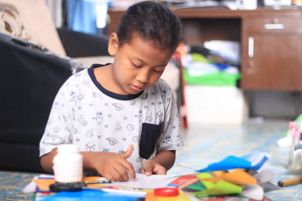istock An elementary student working on crafts at home during the COVID-19 pandemic. 1282873215