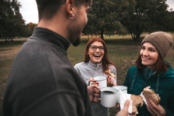 istock Group of friends taking a break after an hike in mountain 1282874819