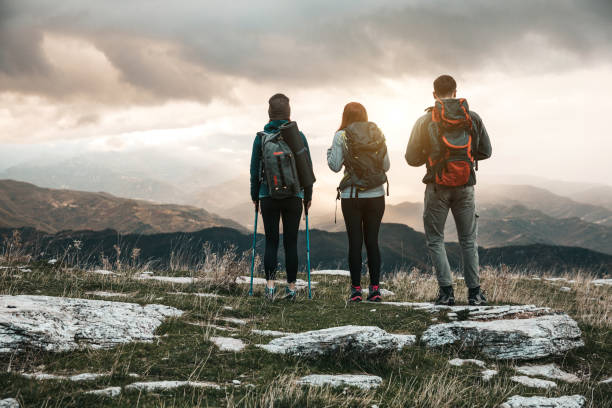 istock Friends hiking together in mountain 1282875858