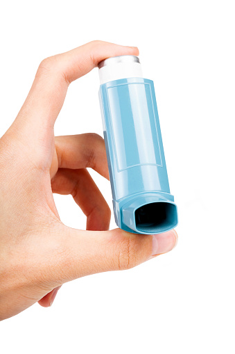 young-person-using-a-blue-pocket-asthma-