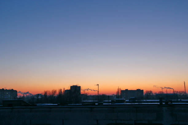 istock Red sunset above multistory house. Evening cityscape 1282877549