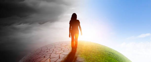 istock Woman in a landscape with climate change 1282877979
