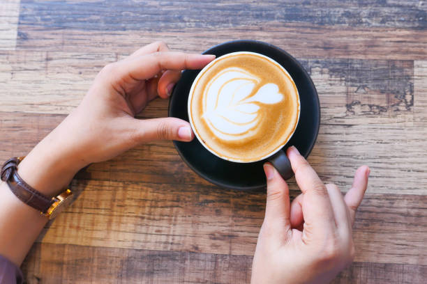 istock top view of women hand holding a coffee cup 1282878005