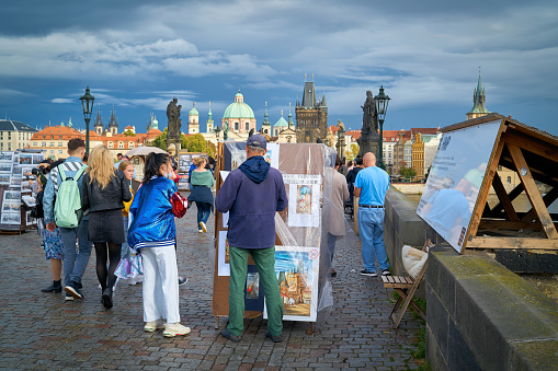 Prague, Czech Republic – October 01, 2019: Tourists from many countries on the Charles Bridge in Prague