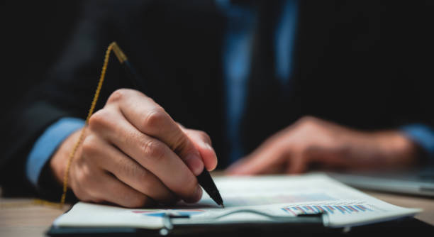 istock Hand signature sign approved business contract for certify and permit on the paper document 1282880377