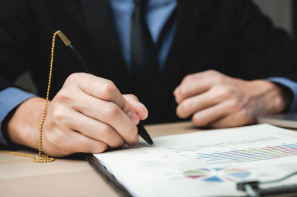 istock Hand signature sign approved business contract for certify and permit on the paper document 1282880457