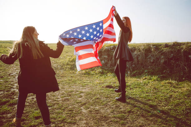 istock Two women holding USA flag 1282880625