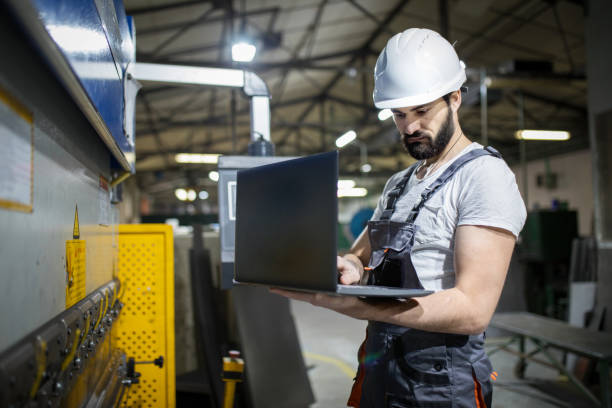 istock Industrial engineer using laptop in factory 1282881470