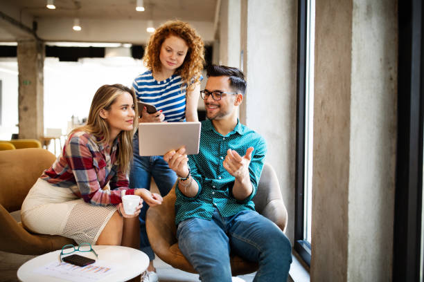 istock Happy creative team in office. Business, startup, design, people and teamwork concept 1282881607