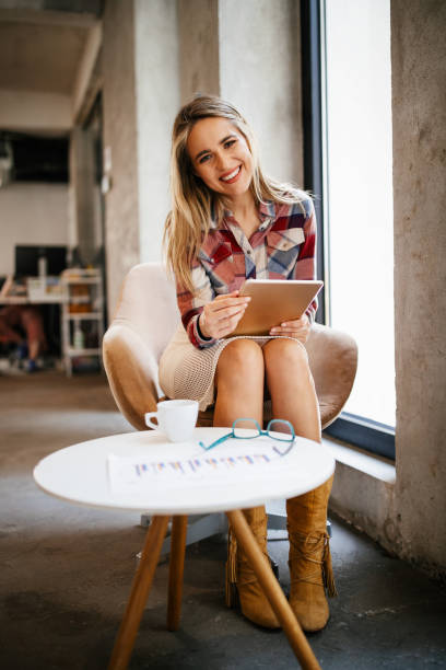istock Beautiful woman using digital tablet for working, reading, surfing 1282881637