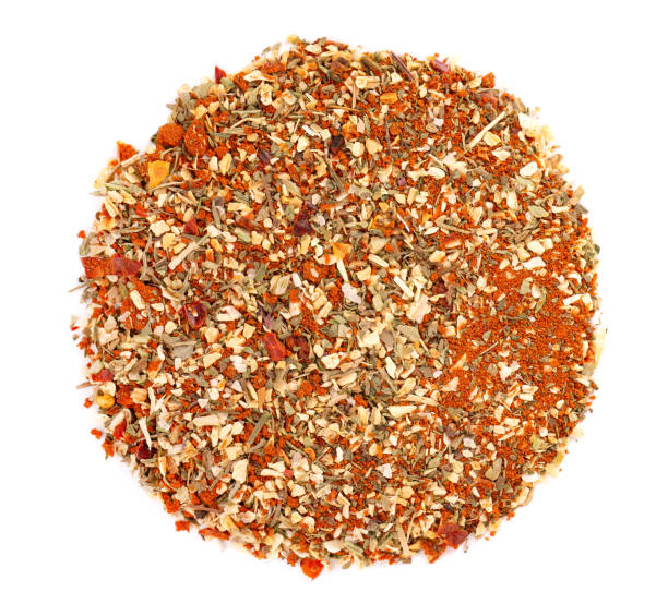 mix of herbs, spices and dry tomatoes, isolated on white background. natural organic food seasoning. top view. - mixed herbs imagens e fotografias de stock